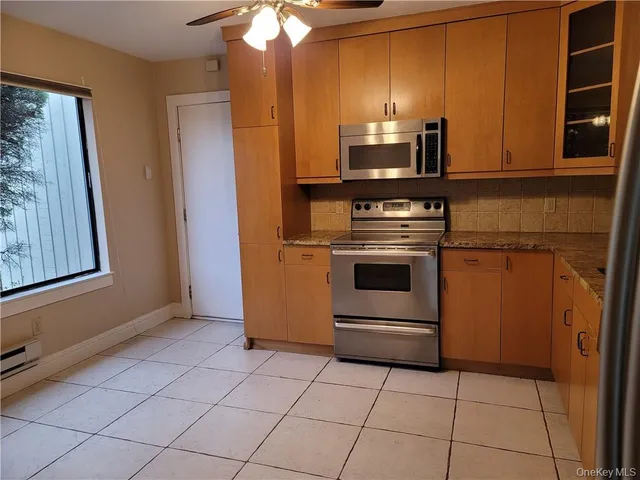 a kitchen with a stove and a microwave