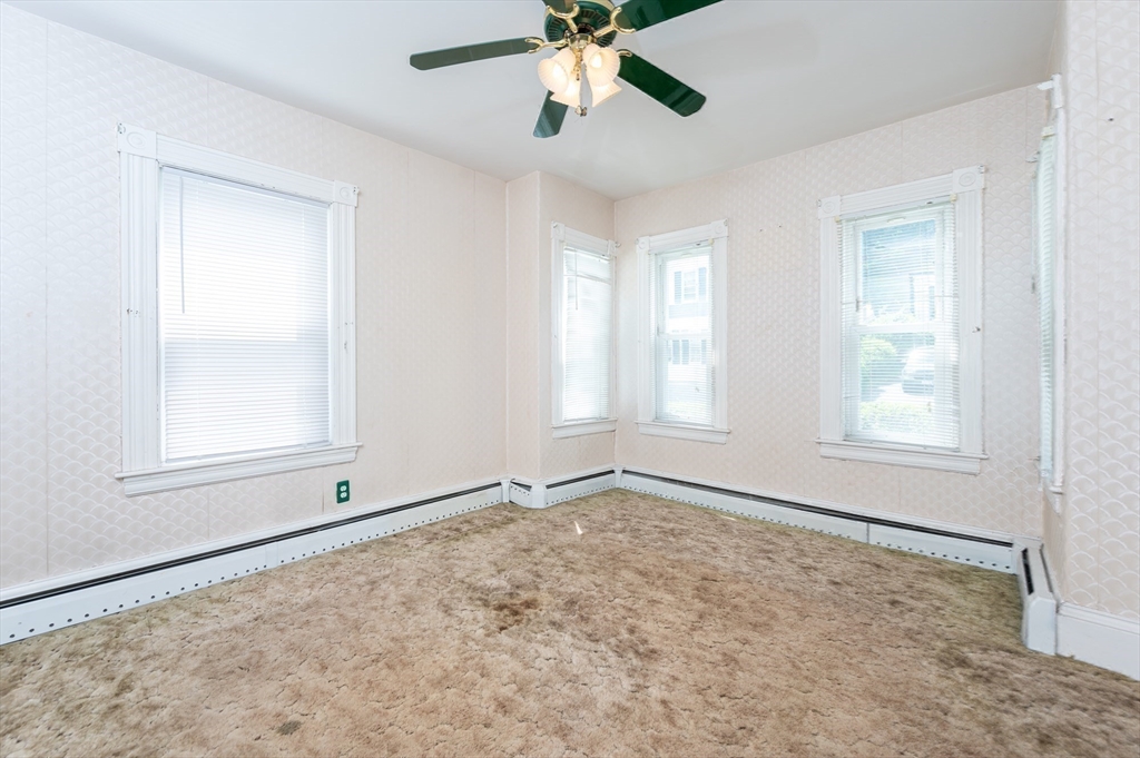 86 Epping Street Lowell, MA 01852 - Photo 14 of 41 a view of an empty room with a window
