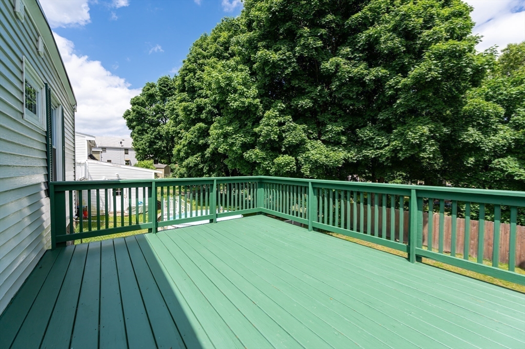 86 Epping Street Lowell, MA 01852 - Photo 20 of 41 a view of backyard with a wooden deck