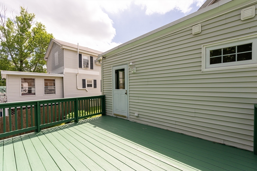 86 Epping Street Lowell, MA 01852 - Photo 22 of 41 a view of a house with a deck