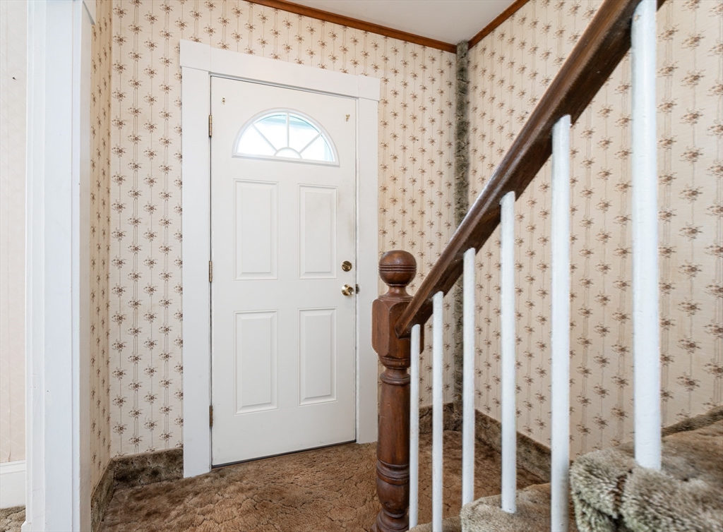 86 Epping Street Lowell, MA 01852 - Photo 24 of 41 a view of a hallway with wooden floor and entryway