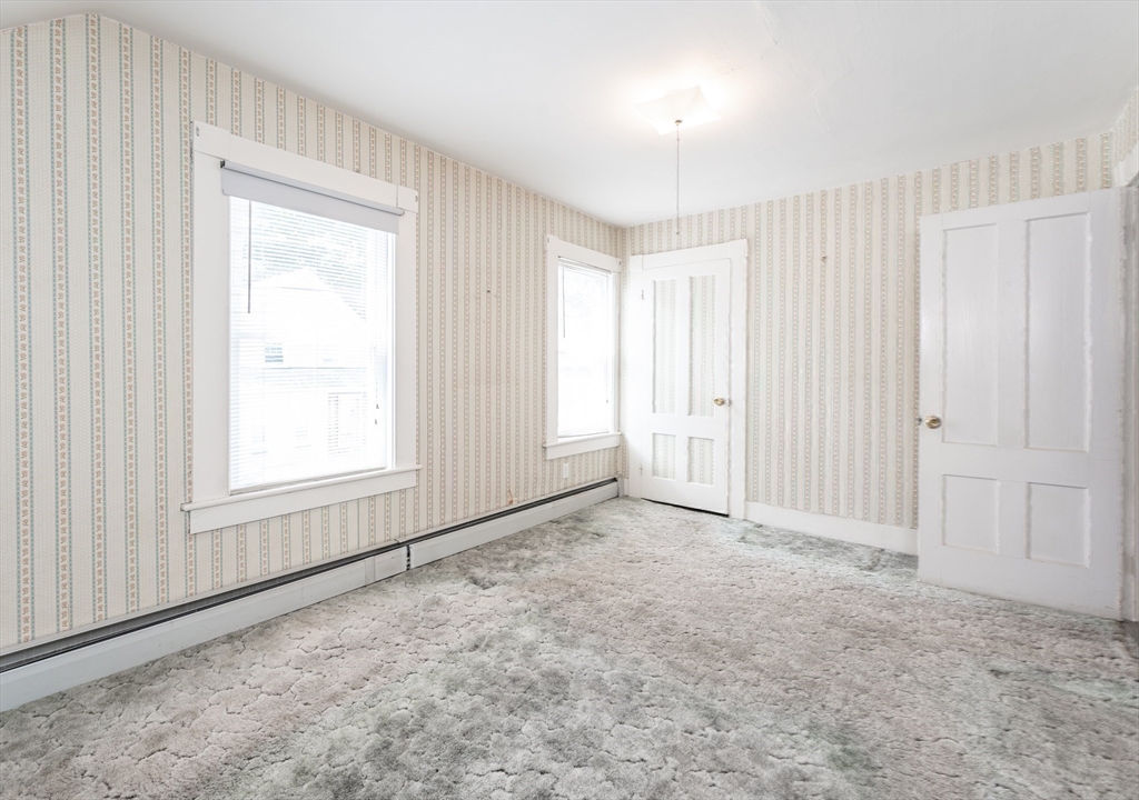86 Epping Street Lowell, MA 01852 - Photo 27 of 41 an empty room with windows