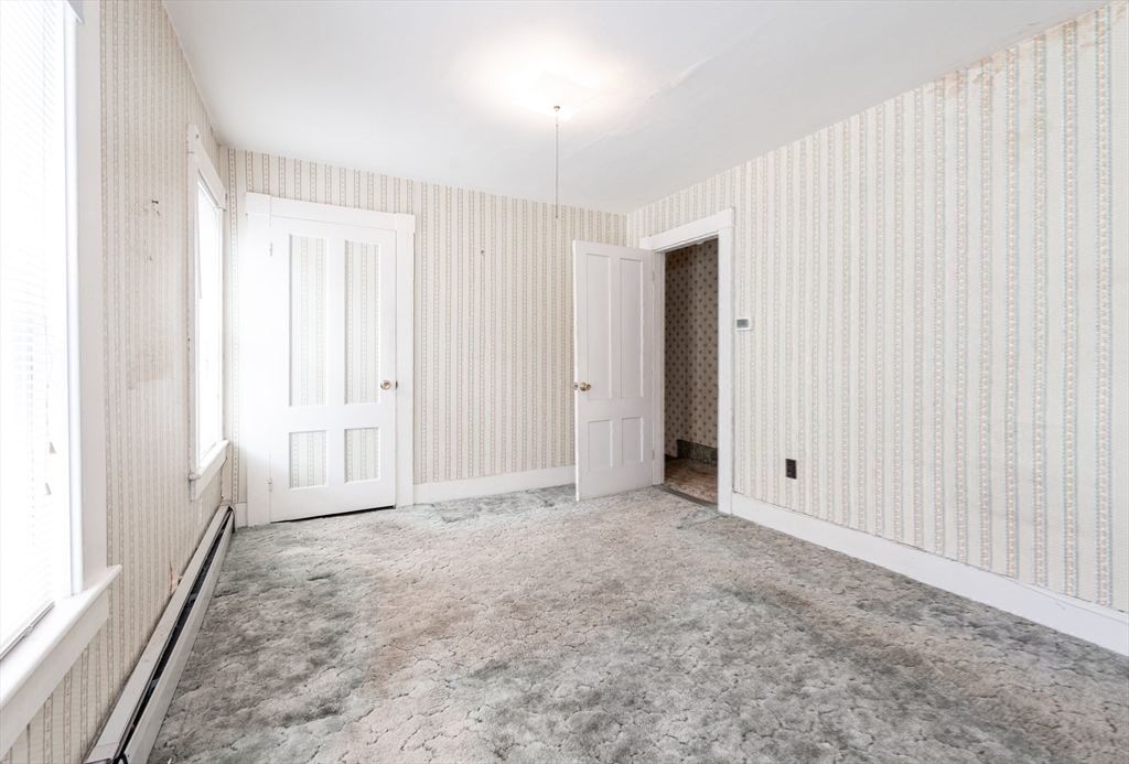 86 Epping Street Lowell, MA 01852 - Photo 29 of 41 an empty room with windows