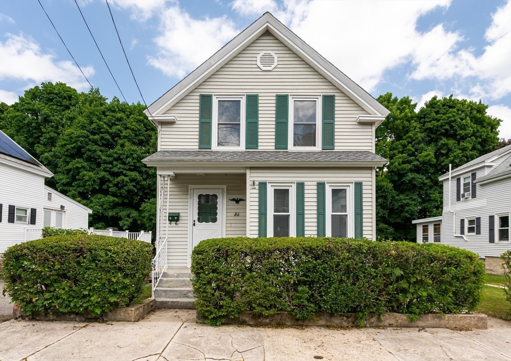 86 Epping Street Lowell, MA 01852 - Photo 40 of 41 a front view of a house with a garden