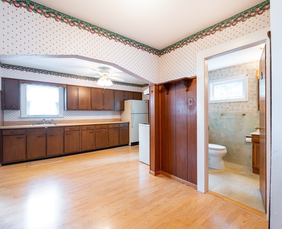86 Epping Street Lowell, MA 01852 - Photo 6 of 41 a bathroom with a double vanity sink toilet and shower