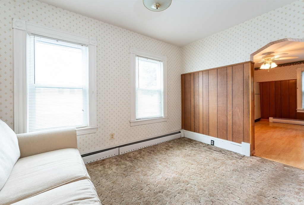 86 Epping Street Lowell, MA 01852 - Photo 9 of 41 a living room with furniture and window