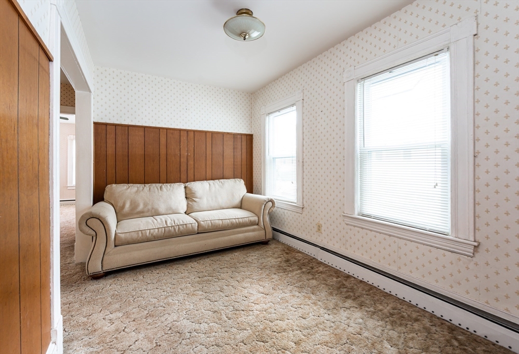 86 Epping Street Lowell, MA 01852 - Photo 10 of 41 a living room with furniture and a window