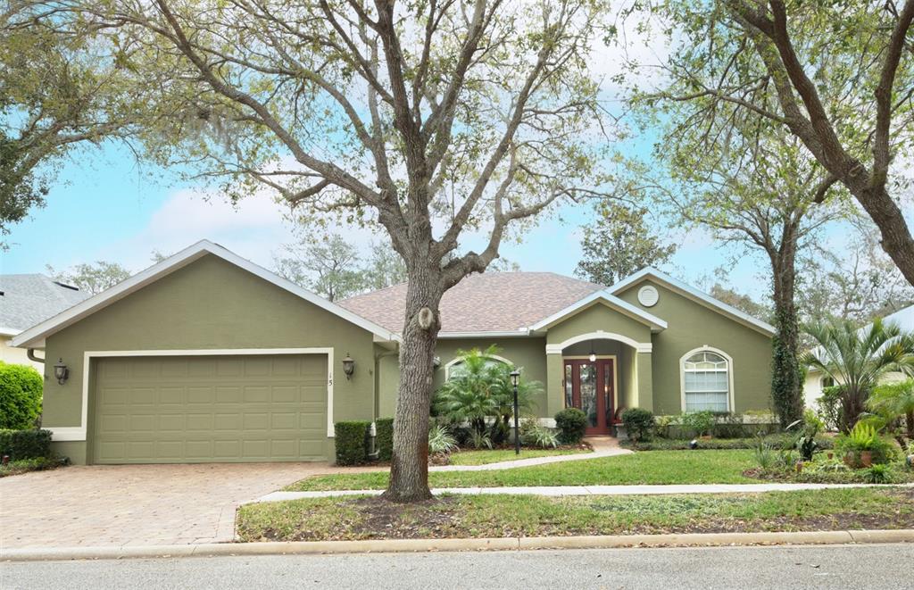 15 Riverbend Drive Palm Coast, FL 32137 - Photo 1 of 1 a front view of a house with a yard and garage