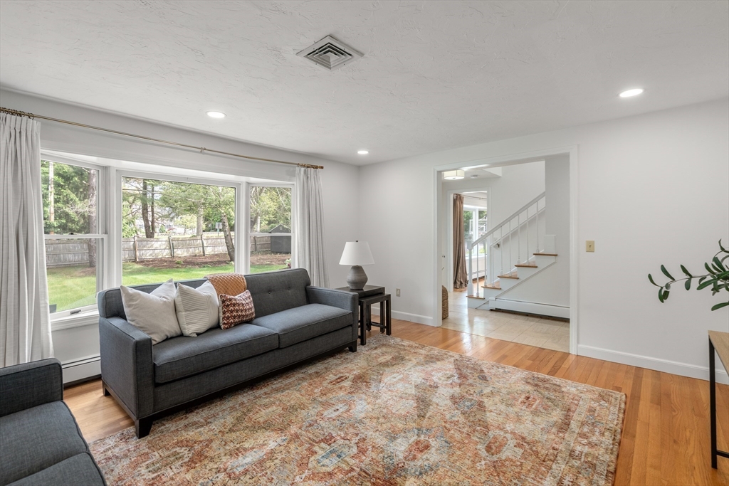 322 Concord Road Wayland, MA 01778 - Photo 6 of 35 a living room with furniture and a large window