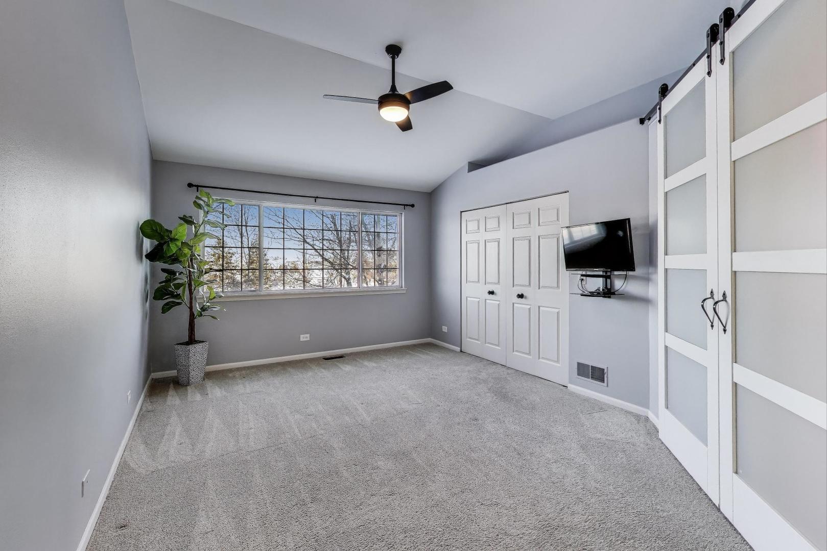 2304 Stonegate Road Algonquin, IL 60102 - Photo 21 of 42 wooden floor in an empty room with a window