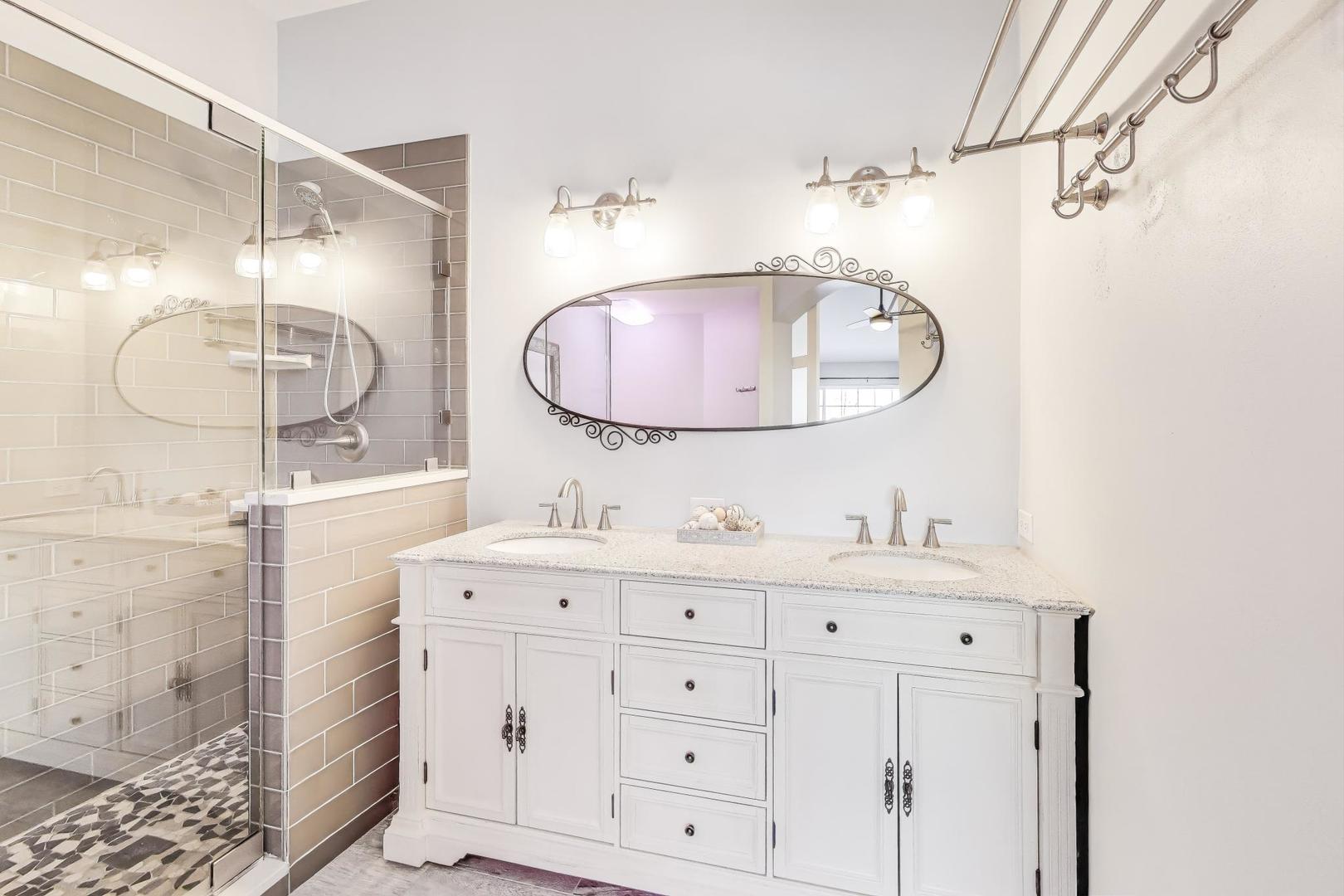 2304 Stonegate Road Algonquin, IL 60102 - Photo 25 of 42 a bathroom with a double vanity sink mirror and shower