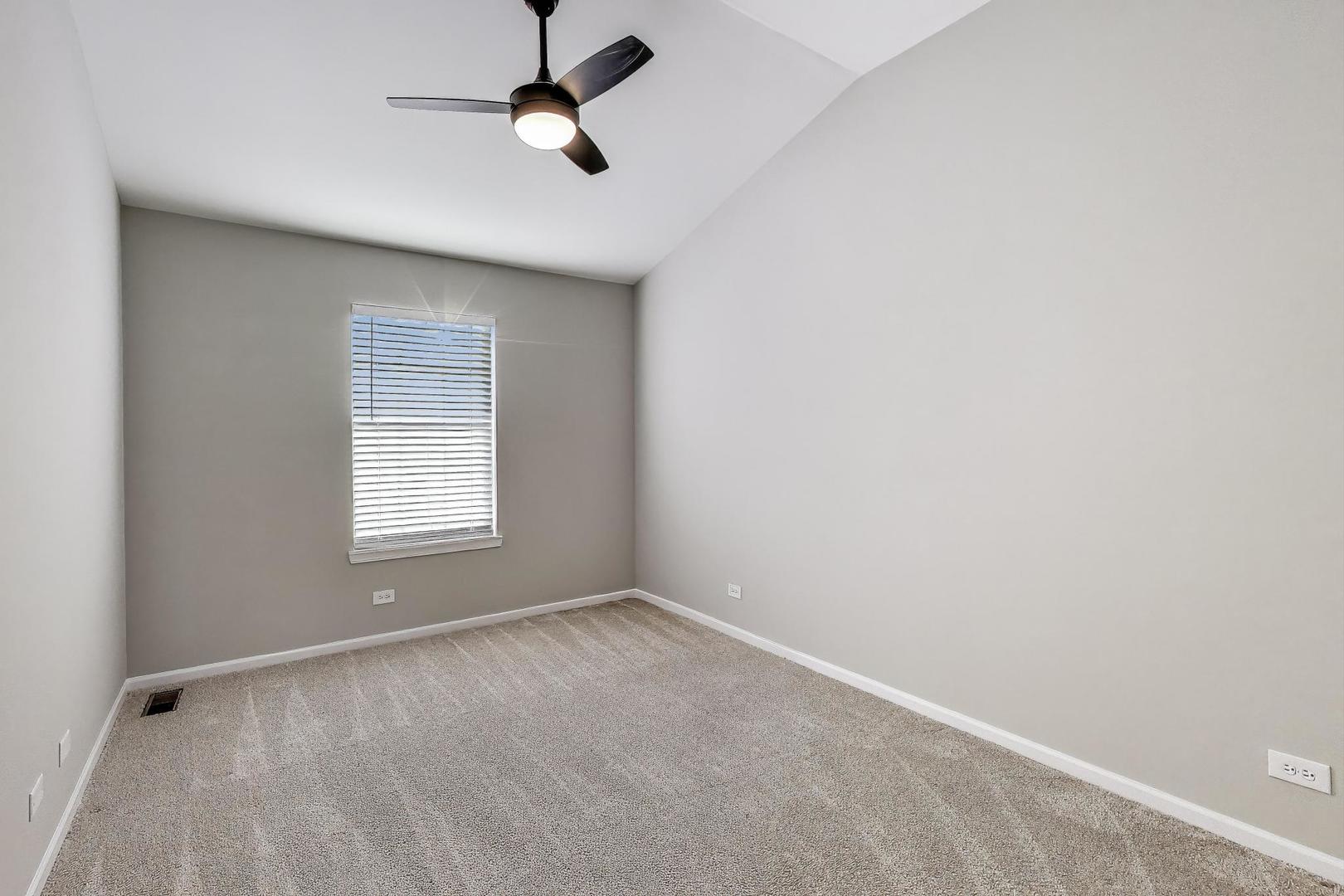 2304 Stonegate Road Algonquin, IL 60102 - Photo 27 of 42 an empty room with a window