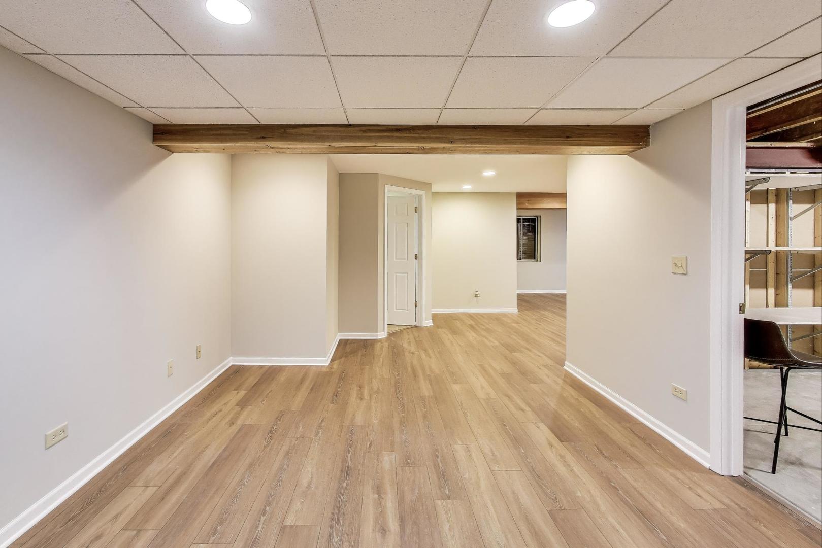 2304 Stonegate Road Algonquin, IL 60102 - Photo 33 of 42 a view of hallway with wooden floor