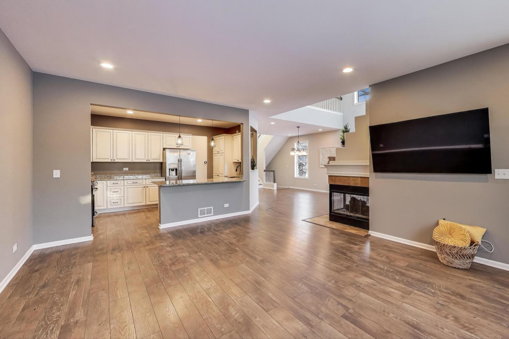 2304 Stonegate Road Algonquin, IL 60102 - Photo 8 of 42 a view of kitchen with furniture and flat screen tv