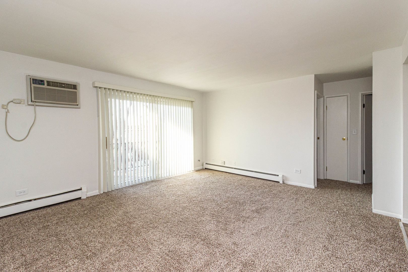 4819 West Engle Road, Unit 2D Alsip, IL 60803 - Photo 3 of 25 an empty room with windows