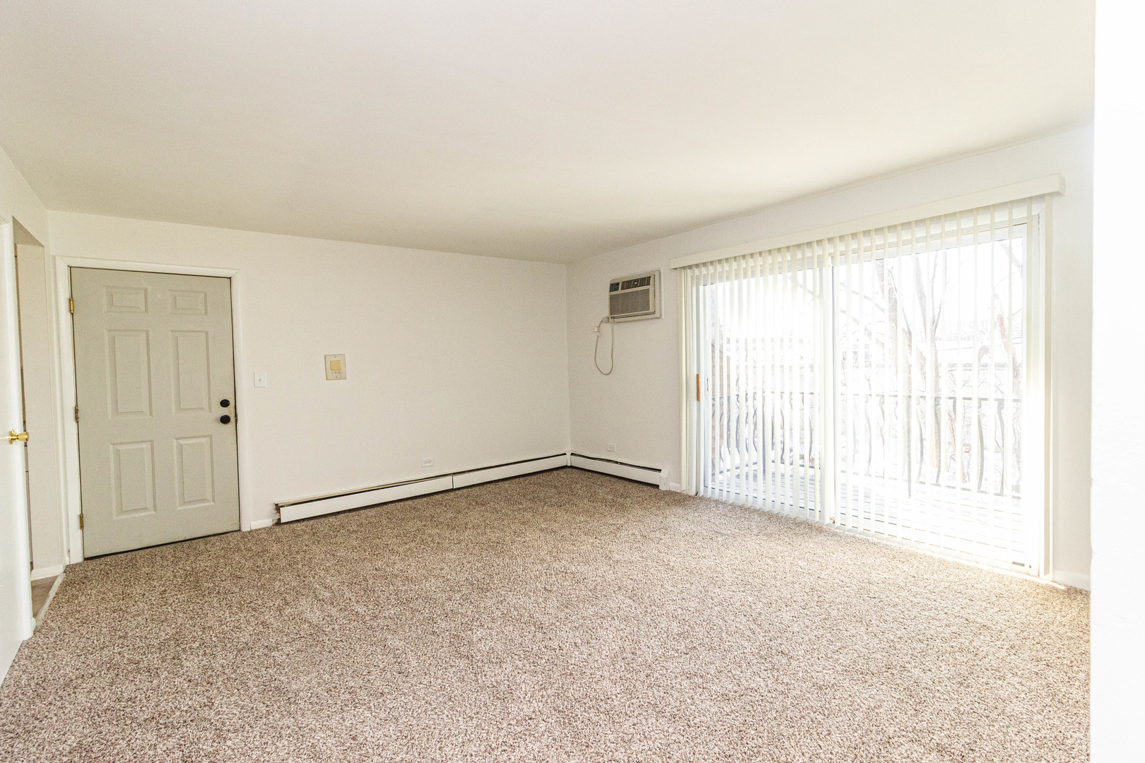 4819 West Engle Road, Unit 2D Alsip, IL 60803 - Photo 4 of 25 an empty room with a empty space and a window
