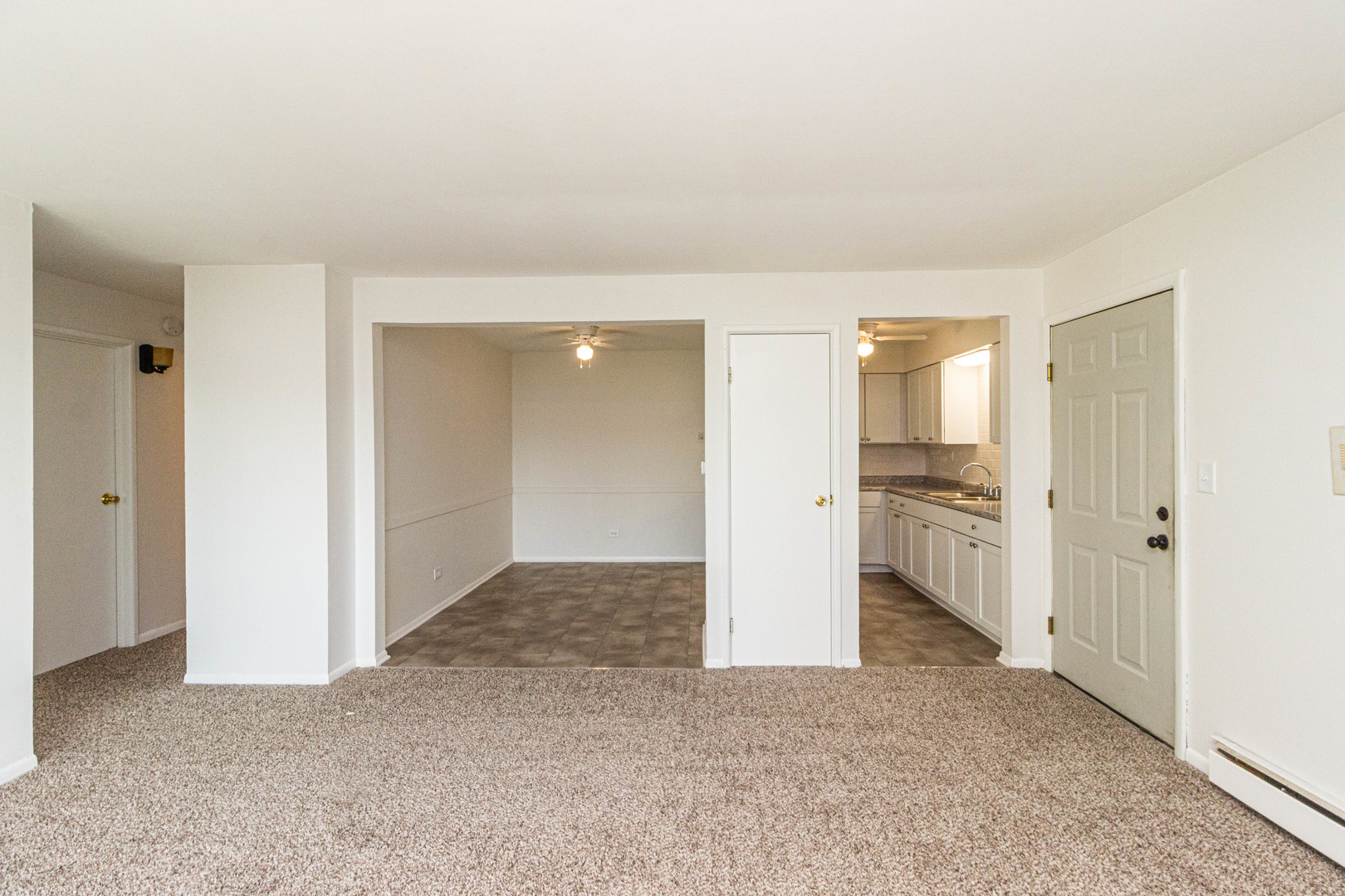 4819 West Engle Road, Unit 2D Alsip, IL 60803 - Photo 6 of 25 a view of a kitchen with a sink and a refrigerator