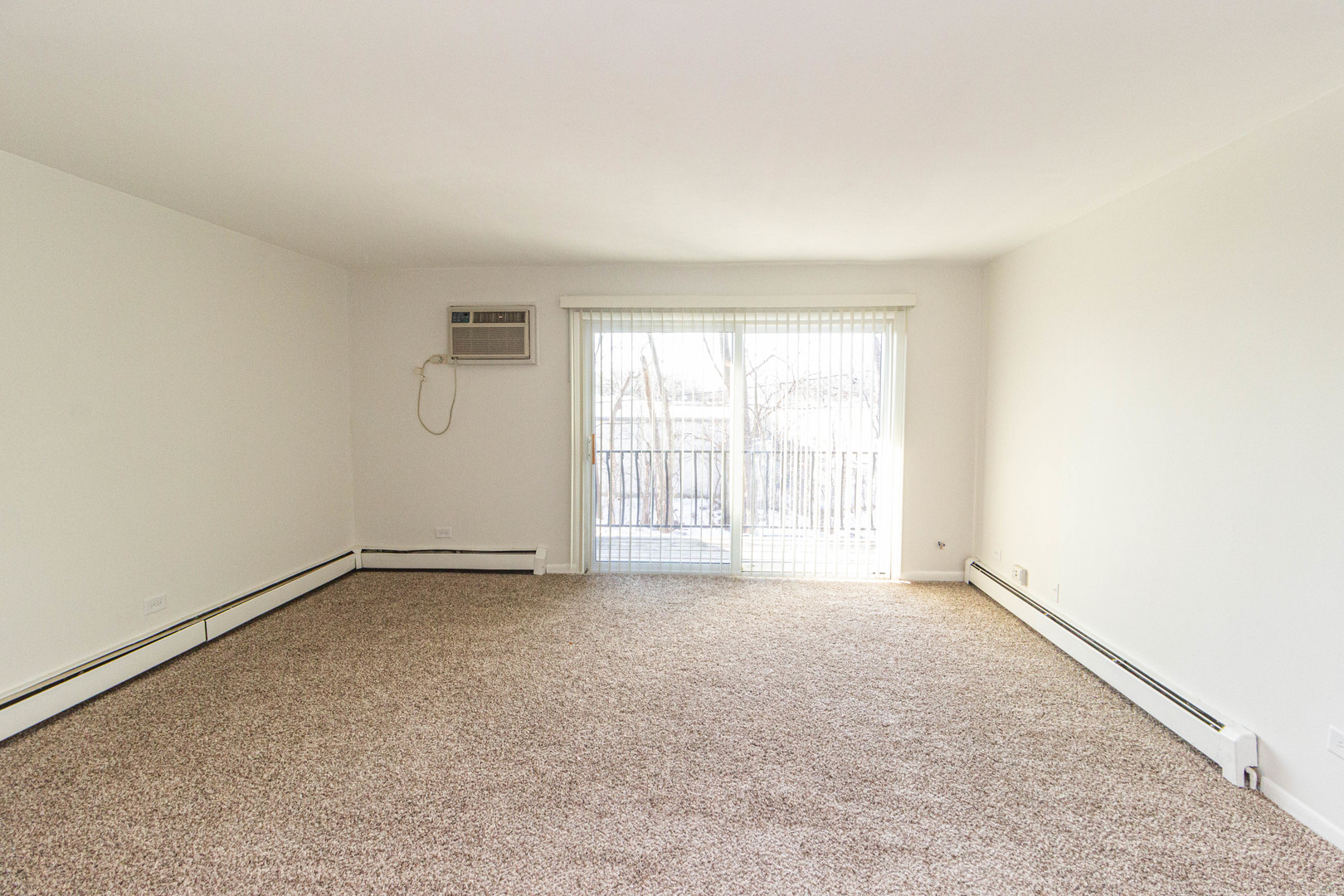 4819 West Engle Road, Unit 2D Alsip, IL 60803 - Photo 7 of 25 an empty room with a empty space and a window