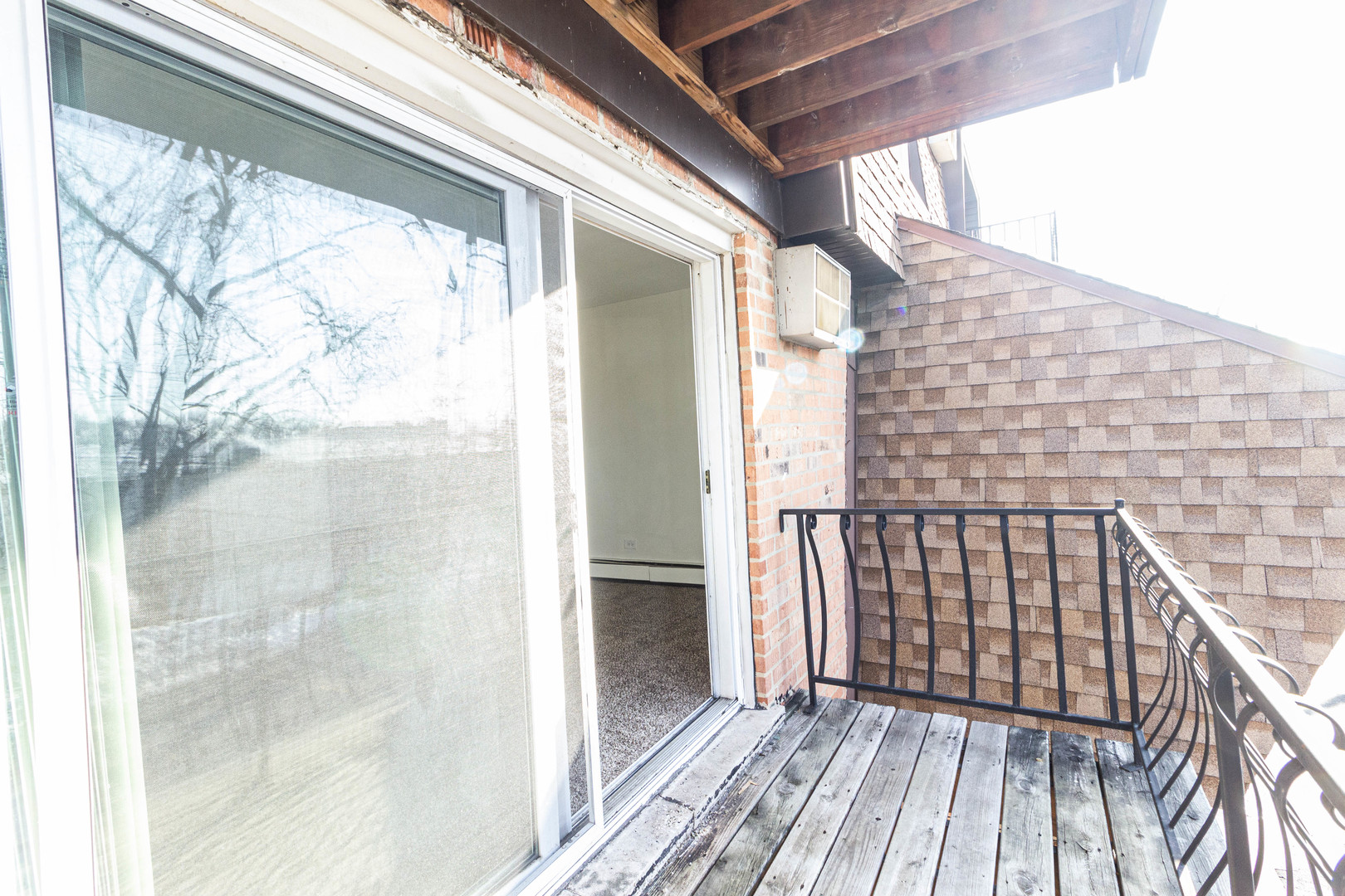 4819 West Engle Road, Unit 2D Alsip, IL 60803 - Photo 9 of 25 a view of balcony with wooden floor and fence