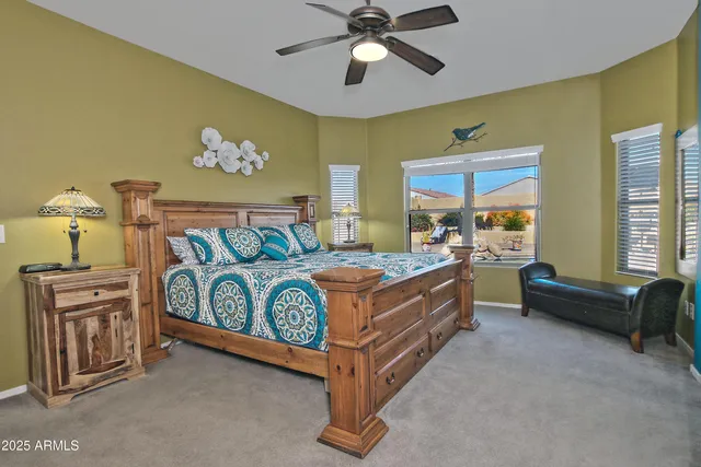 a bed room with a bed and a chandelier