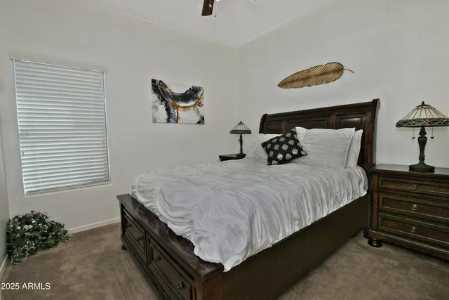 a bedroom with bed and window