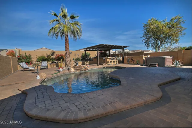 a view of a swimming pool with a chair
