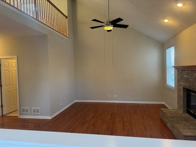 a view of room with wooden floor