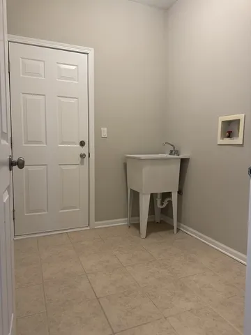 an empty room with a bench