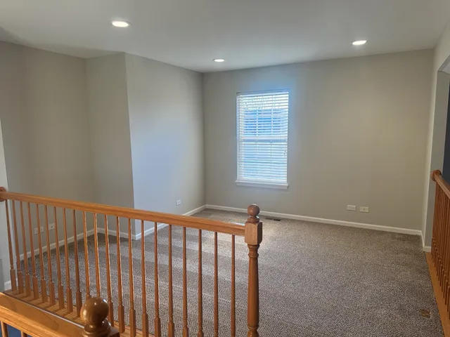 a view of hallway with windows