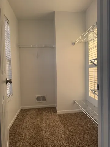 a view of an empty room and window