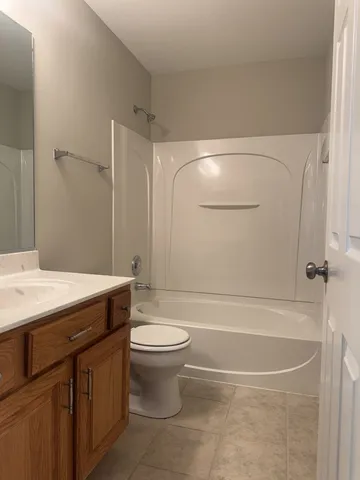 a view of a room with wooden walls