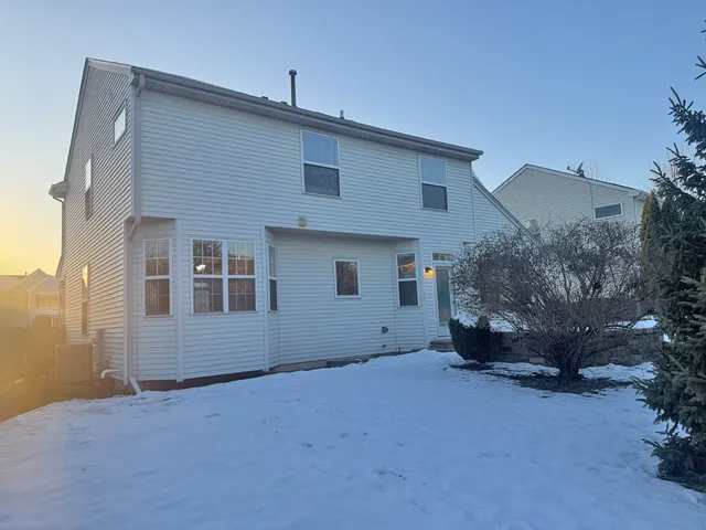 a view of a house with a backyard