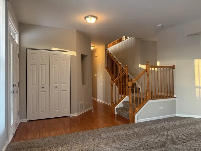 a view of an entryway with wooden floor