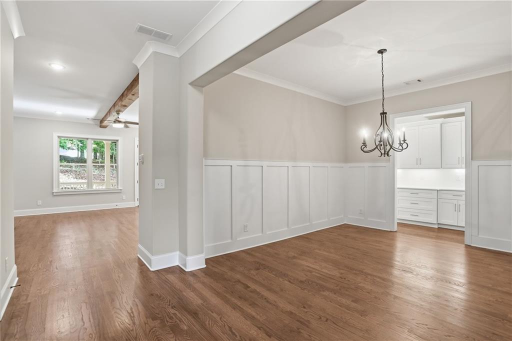222 Trecastle Square, Unit 21 Canton, GA 30114 - Photo 5 of 33 a view of a room with wooden floor chandelier and windows