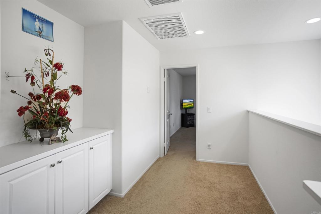 35652 Asturian Way Fallbrook, CA 92028 - Photo 13 of 34 a view of hallway with wooden floor