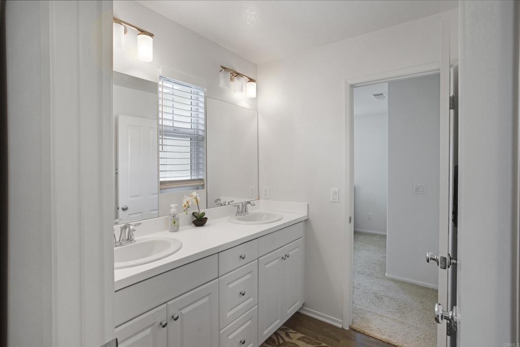 35652 Asturian Way Fallbrook, CA 92028 - Photo 18 of 34 a bathroom with a sink double vanity and mirror