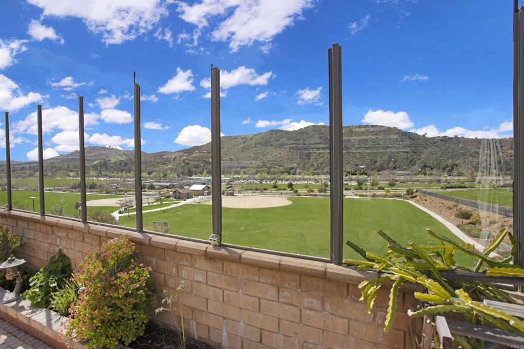 35652 Asturian Way Fallbrook, CA 92028 - Photo 23 of 34 a view of a street with a view of a building with a tree in a yard