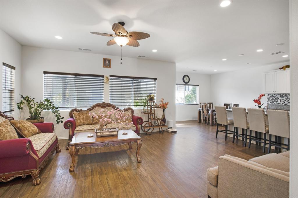 35652 Asturian Way Fallbrook, CA 92028 - Photo 10 of 34 a living room with furniture kitchen view and a large window