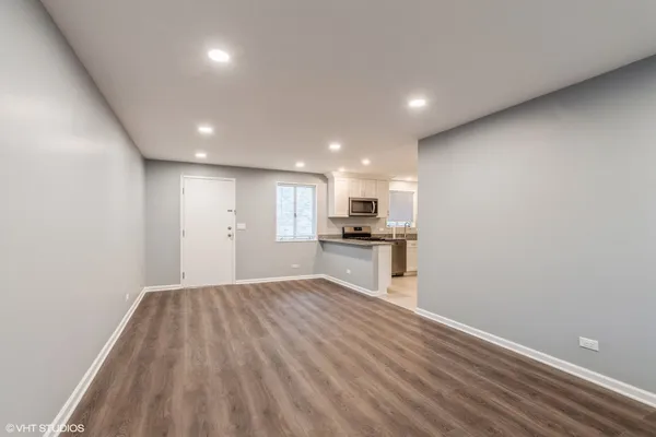 a view of kitchen with wooden floor