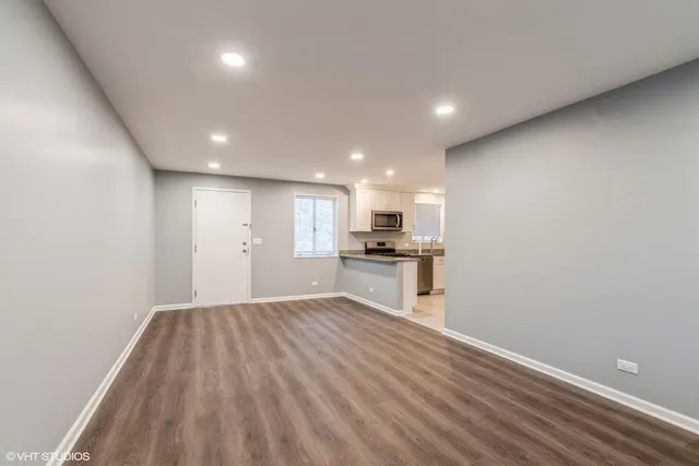 a view of kitchen with wooden floor