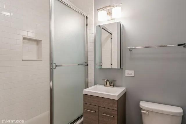 a bathroom with a sink toilet and vanity