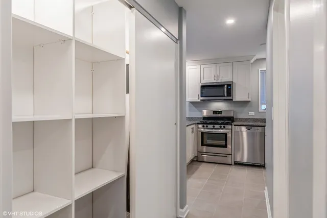 a kitchen with cabinets and appliances