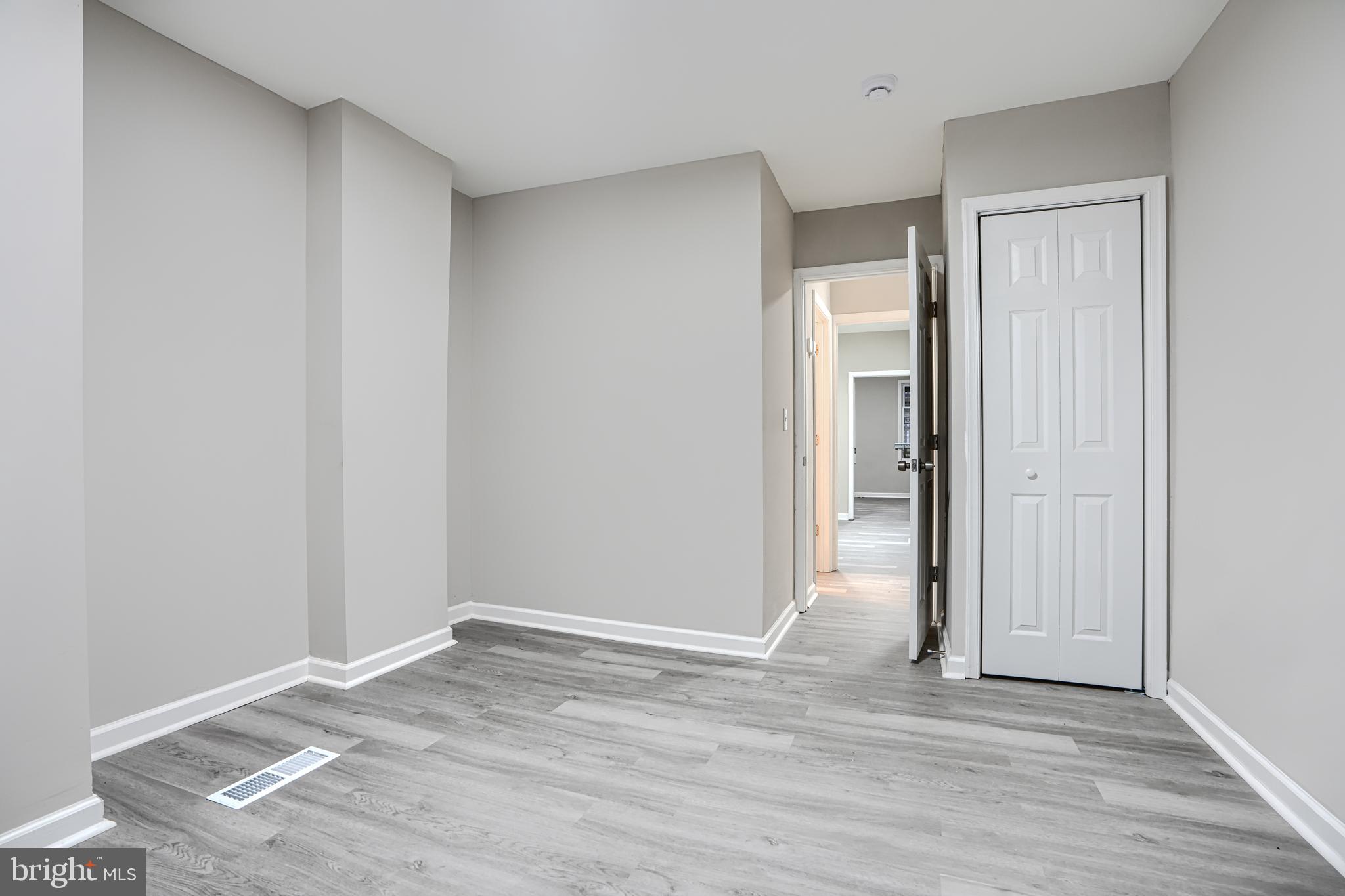 717 North Streeper Street Baltimore, MD 21205 - Photo 14 of 29 a view of a room with wooden floor and closet