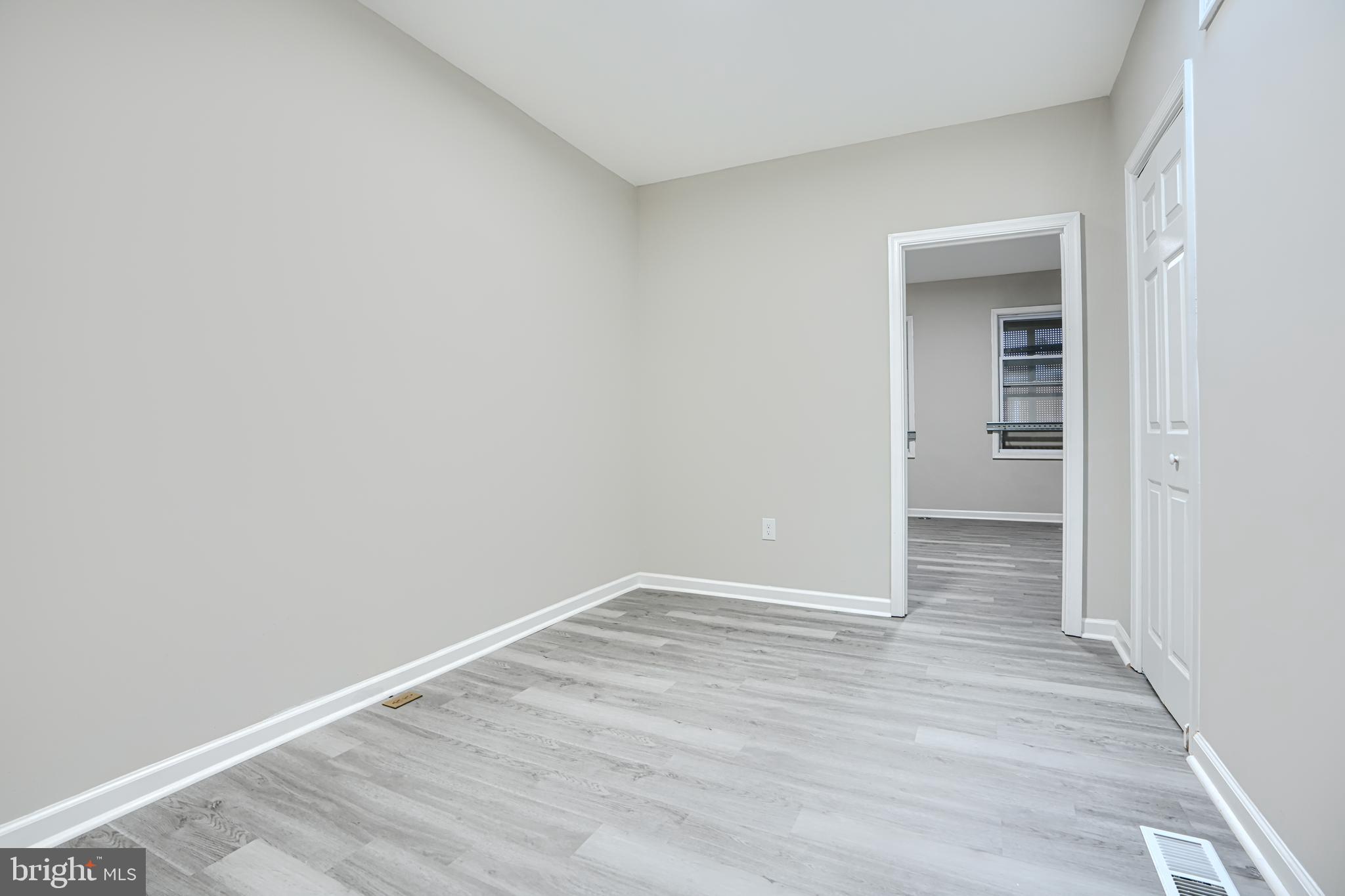 717 North Streeper Street Baltimore, MD 21205 - Photo 16 of 29 a view of an empty room with wooden floor