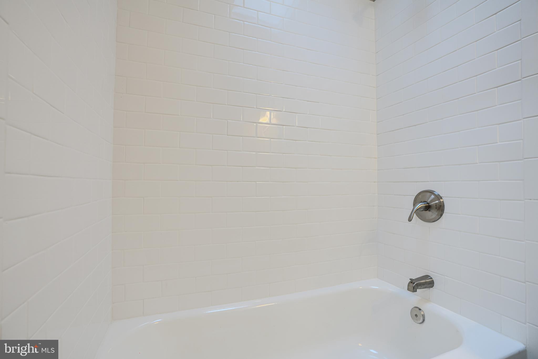 717 North Streeper Street Baltimore, MD 21205 - Photo 20 of 29 a close up of a bathtub