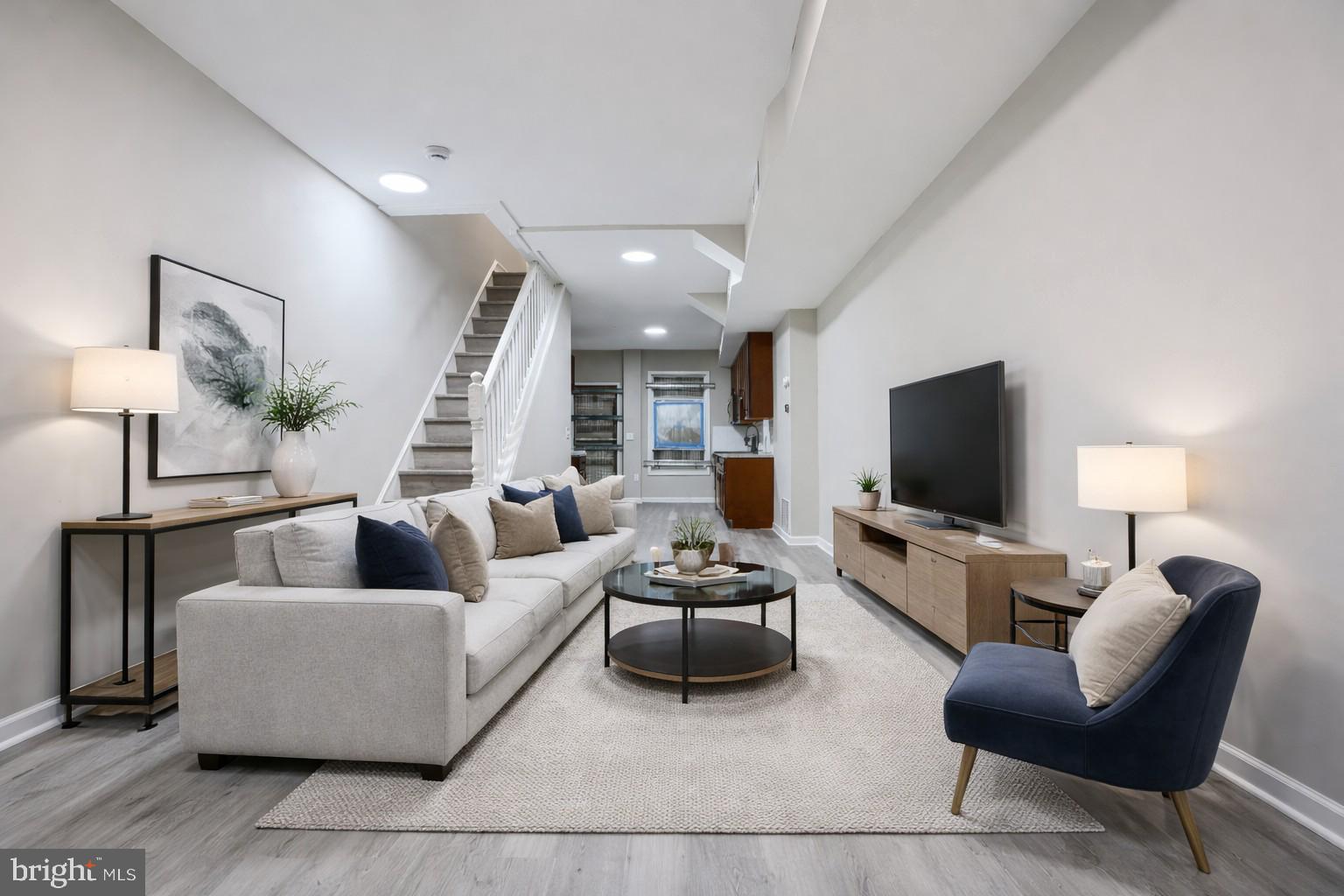 717 North Streeper Street Baltimore, MD 21205 - Photo 2 of 29 a living room with furniture and a flat screen tv