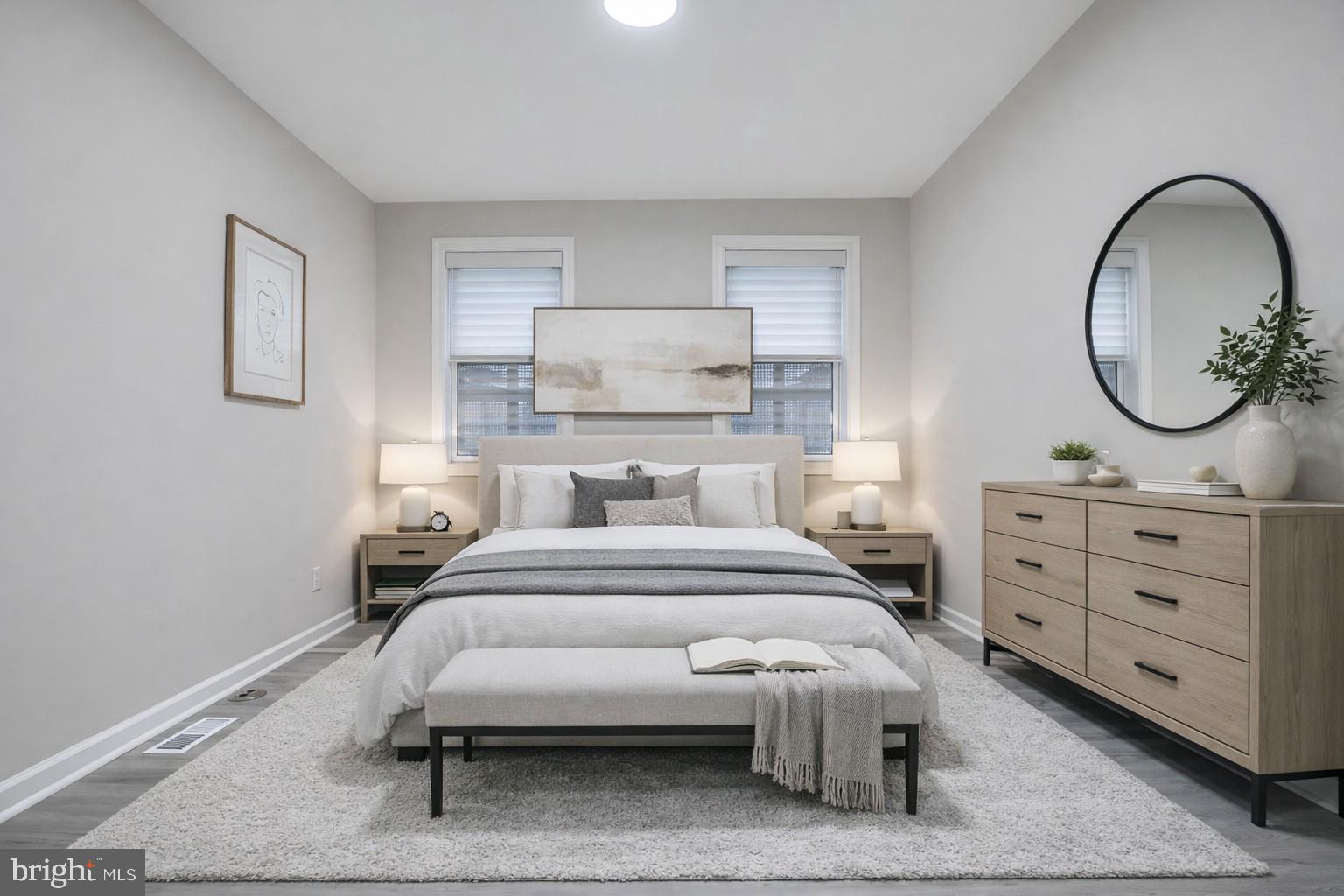 717 North Streeper Street Baltimore, MD 21205 - Photo 21 of 29 a bedroom with a bed and a dresser