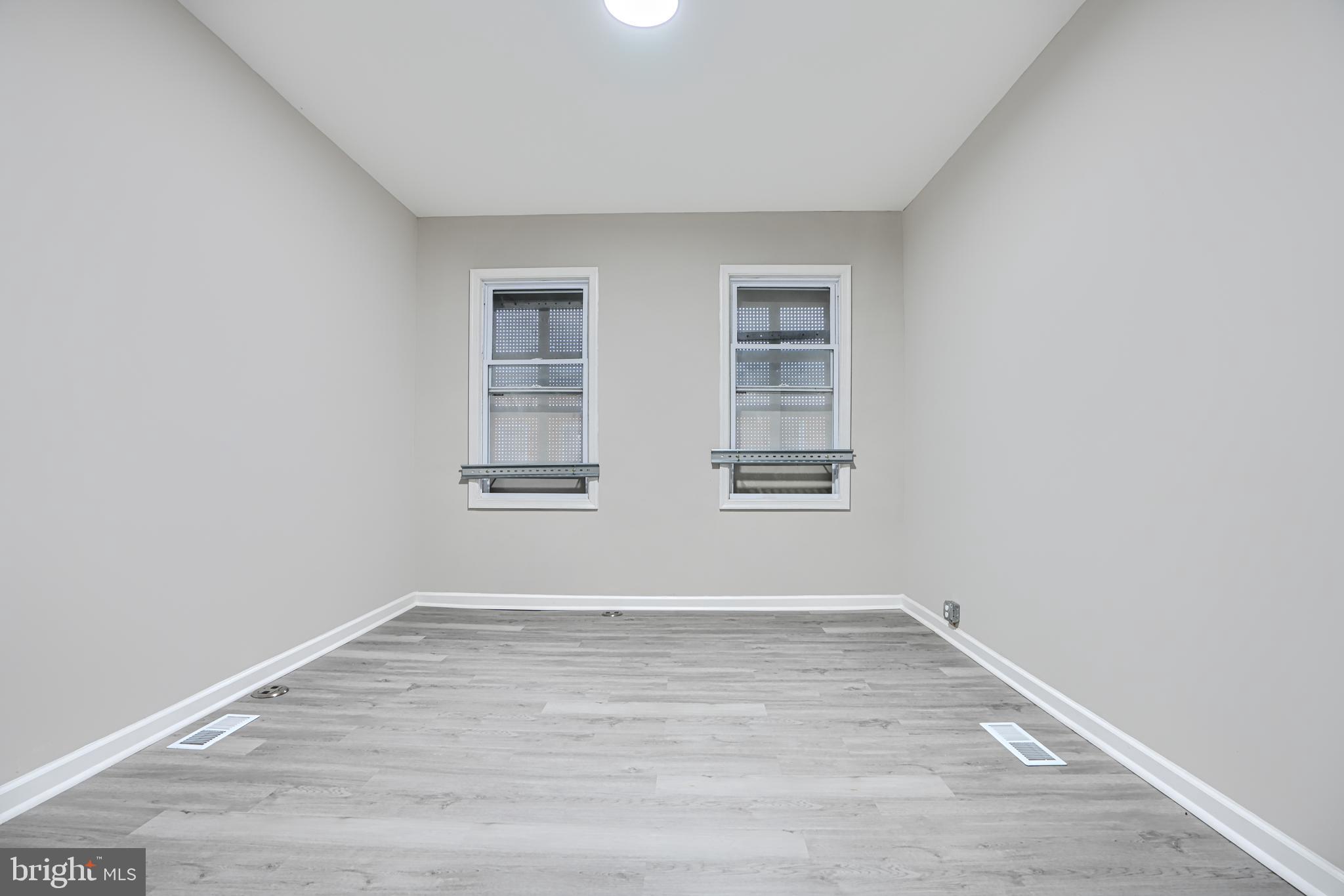 717 North Streeper Street Baltimore, MD 21205 - Photo 22 of 29 wooden floor in an empty room