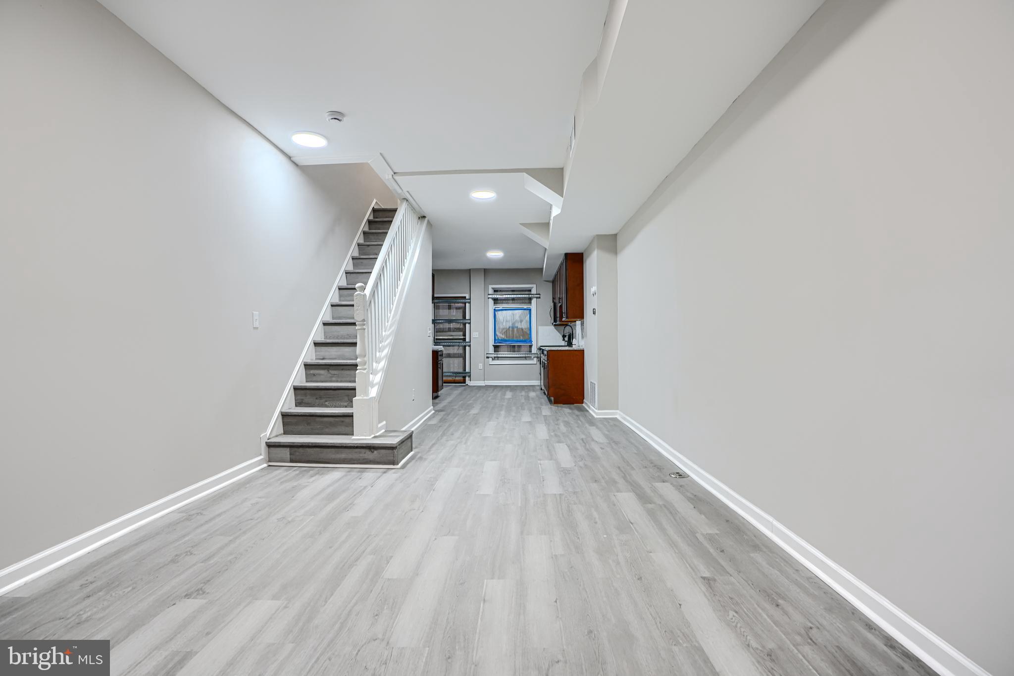 717 North Streeper Street Baltimore, MD 21205 - Photo 3 of 29 a view of entryway and hall with wooden floor