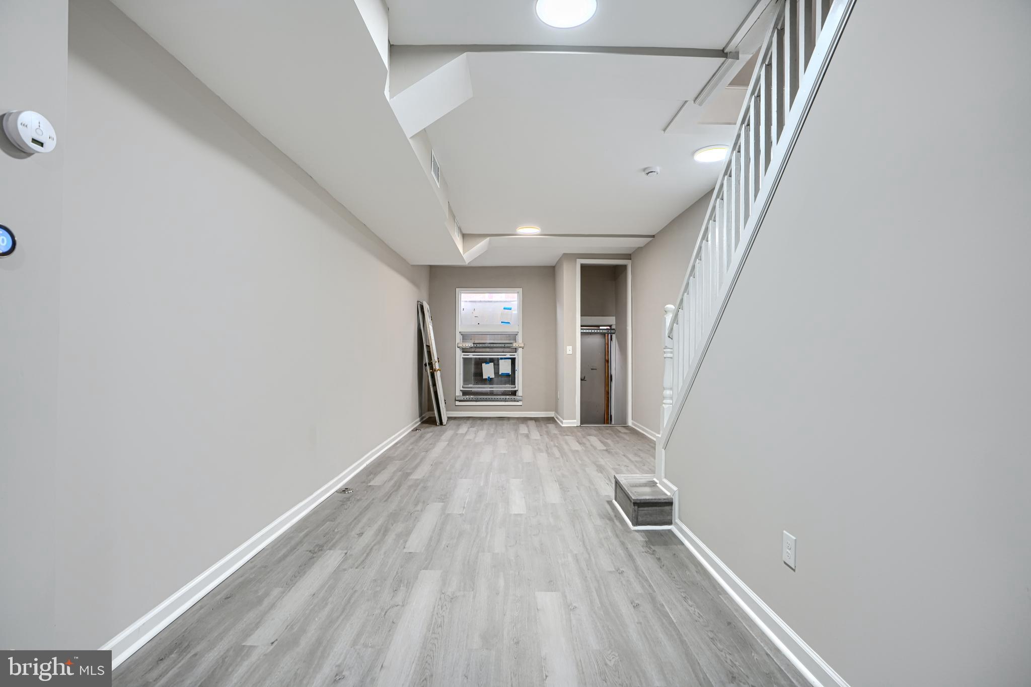 717 North Streeper Street Baltimore, MD 21205 - Photo 6 of 29 a view of hallway with wooden floor